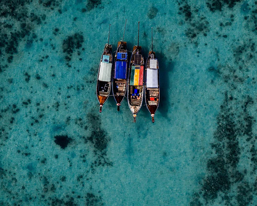 Four boats on water