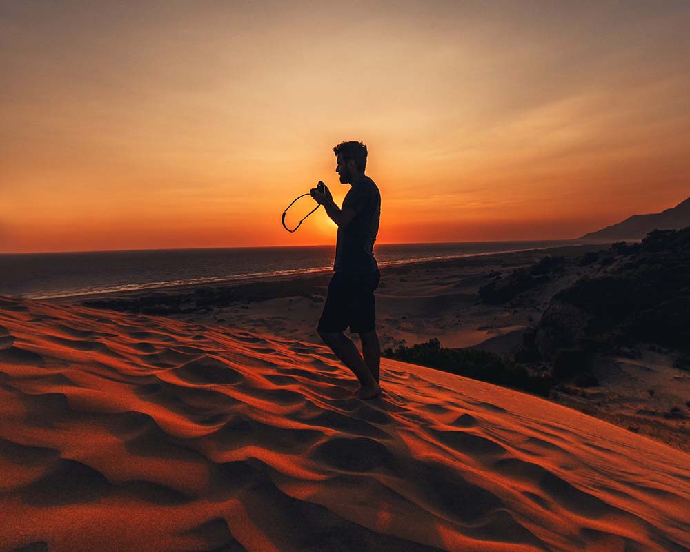 Man in camera in desert